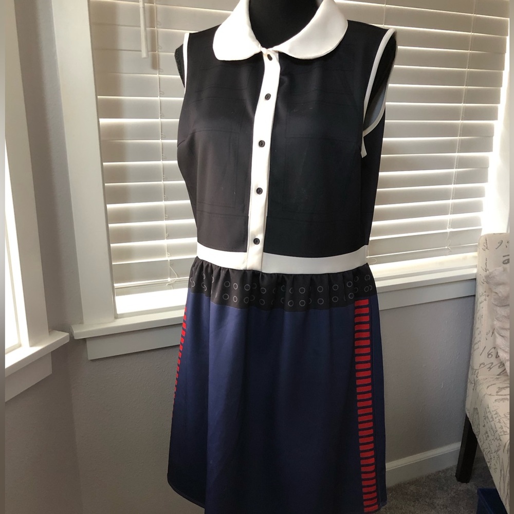 Sleeveless multicolor fun dress navy and white with red accents.